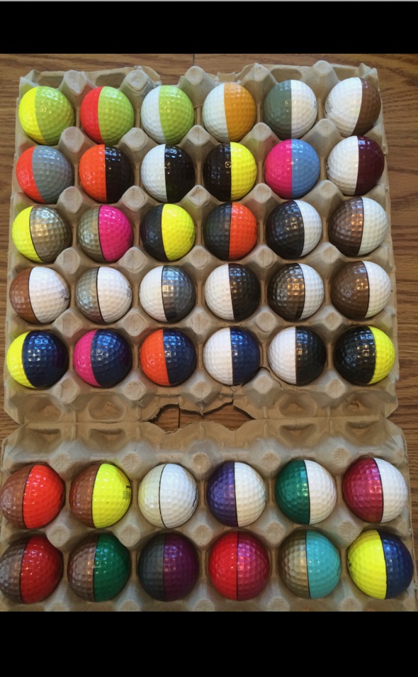 Karsten Solheim hand-painted test balls in egg carton showing color prototypes